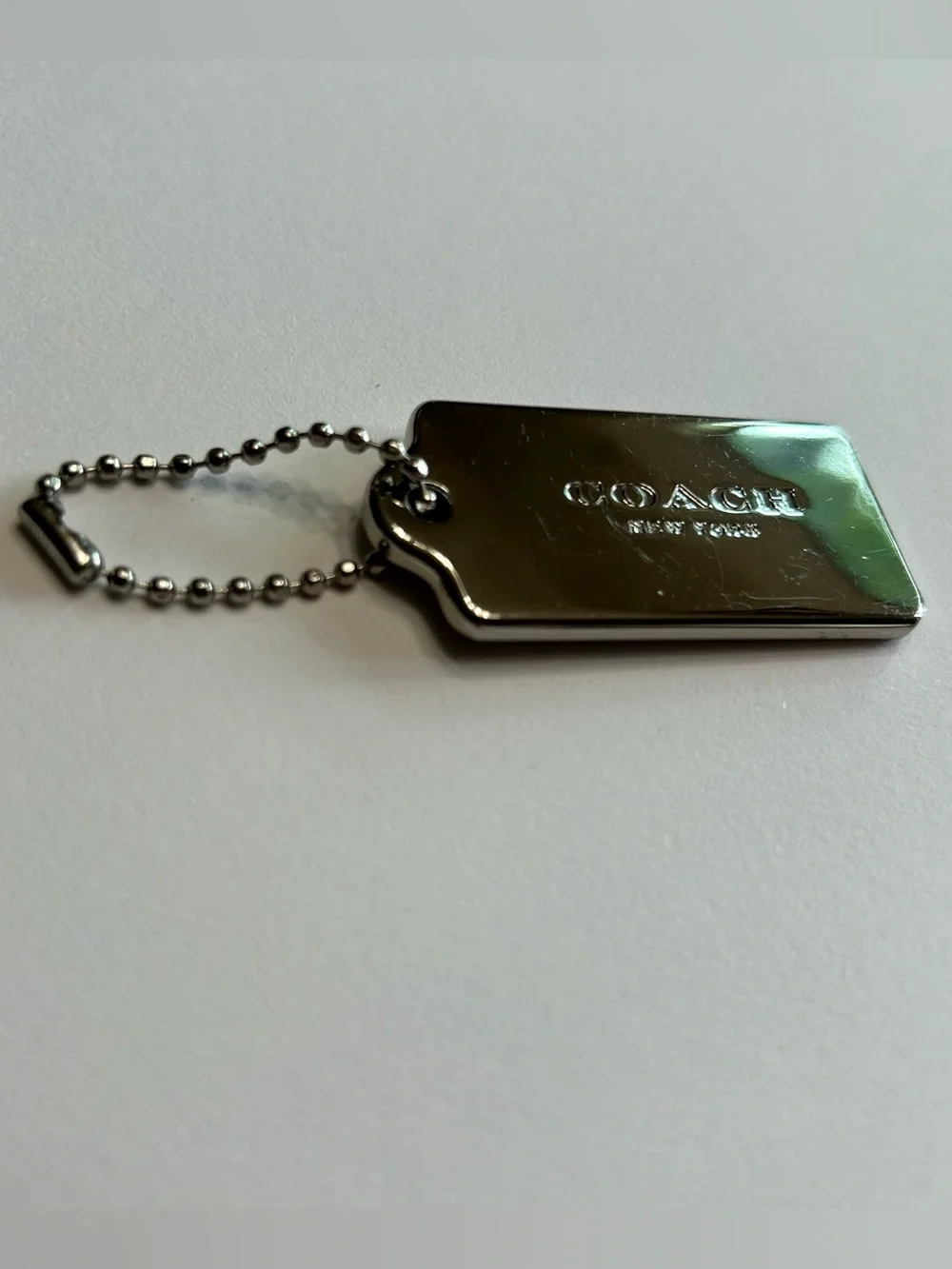 Coach New York silver-tone metal hangtag bag charm